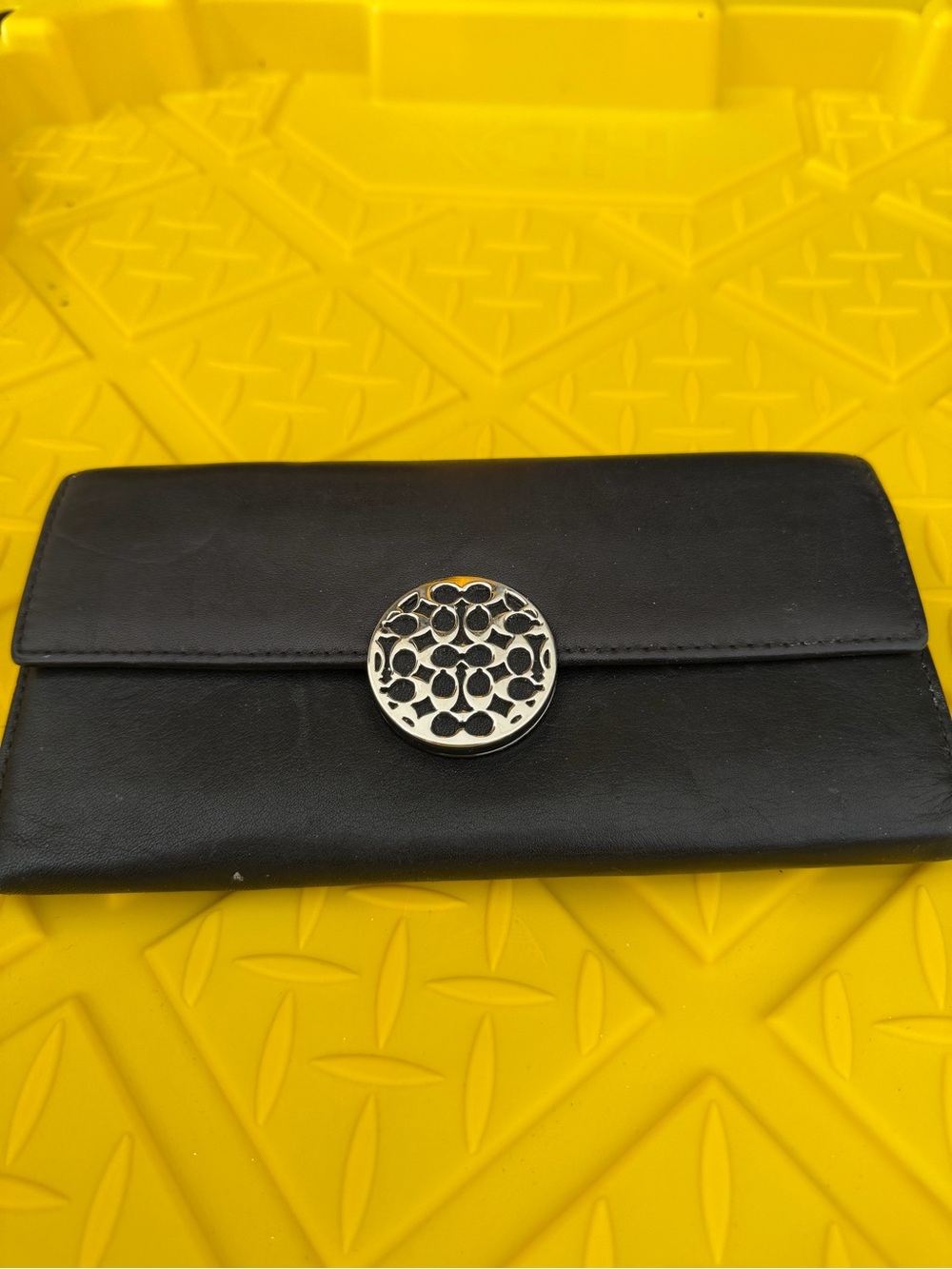 Coach Black Leather Wallet with Silver Medallion Accent